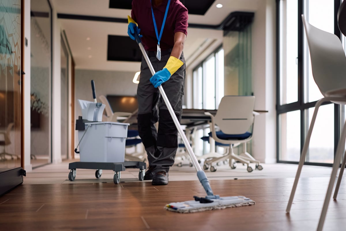 Cleaner working through a property during a booked clean
